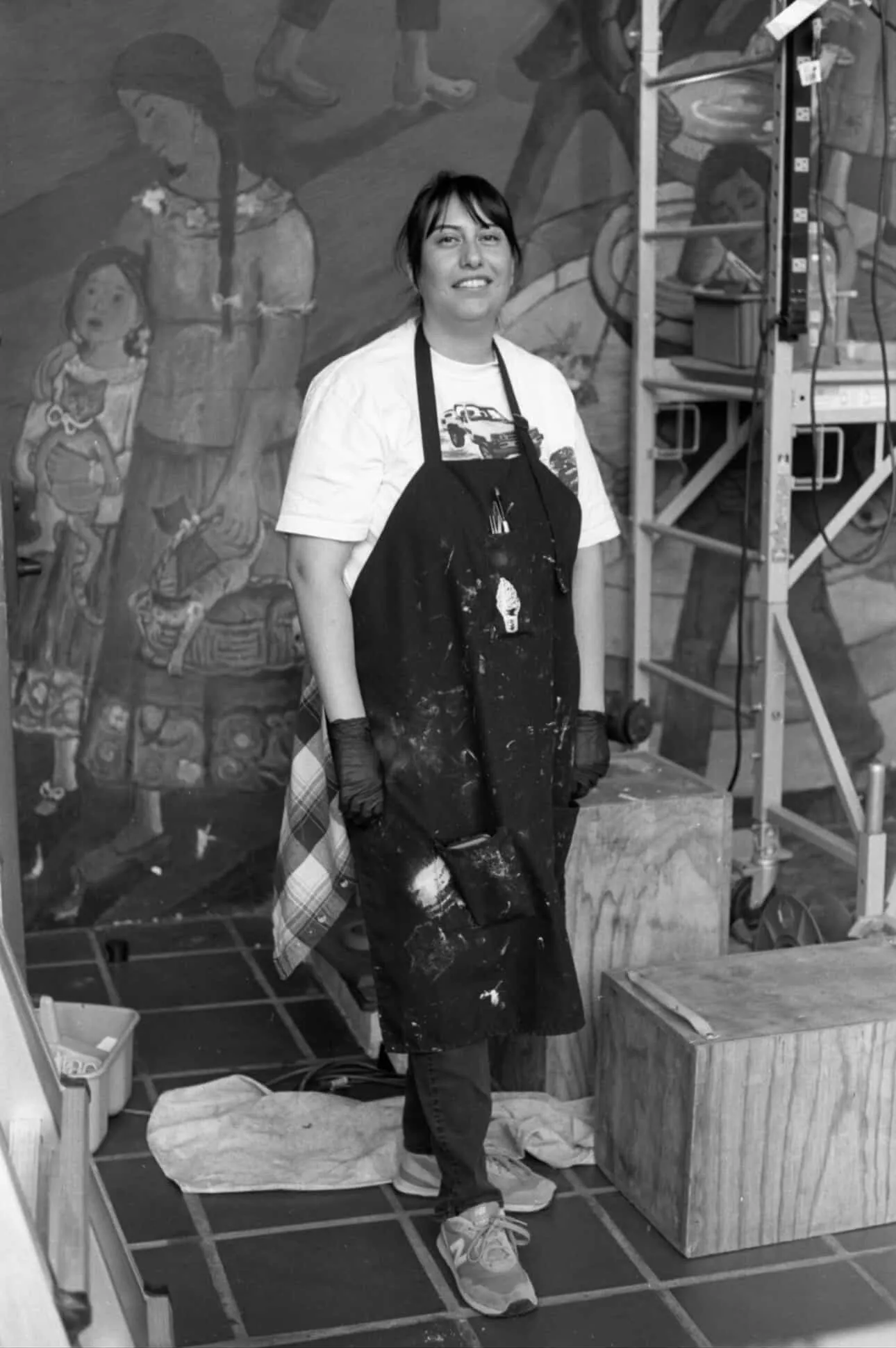 Jennifer Payan examining the lower benches and base plaster of the mural